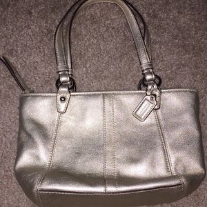Coach gold zip mini purse with one inside pocket